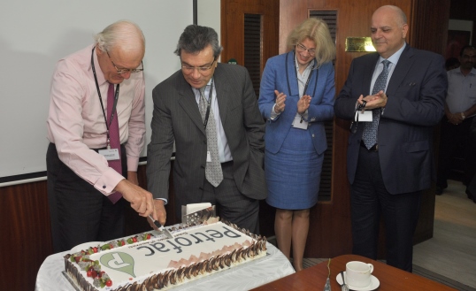 Ayman Asfari and Rijnhard van Tets cut a birthday cake